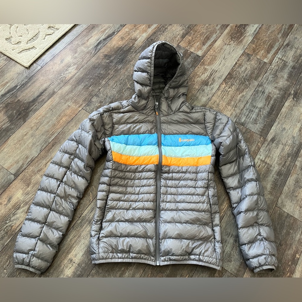 cotopaxi Gray Puffer Jacket with Blue and Orange Chest Stripes